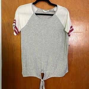 Pink rose T-shirt size medium. Gray and white color with red stripes on sleeve.